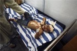 A wounded Palestinian boy lies on a hospital bed following an Israeli air strike in Rafah camp in the southern Gaza Strip Oct. 7, 2012