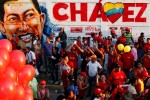 People attend a campaign rally by Venezuela's President Hugo Chavez, who is seeking re-election in an October 7 presidential vote, in Guarenas in the state of Miranda September 29, 2012. REUTERS/Jorge Silva
