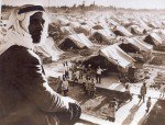 Man overlooks school in Nakba refugee camp